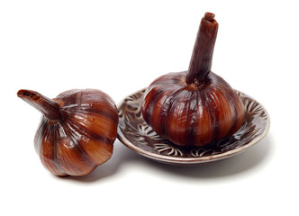 Sweet and sour garlic on white background 