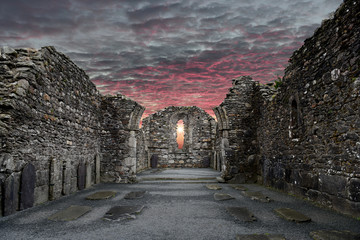 Monastic cemetery of Glendalough, Ireland. Famous ancient monastery while sunset in the wicklow...