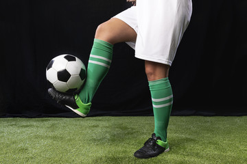 Football in sportswear with ball