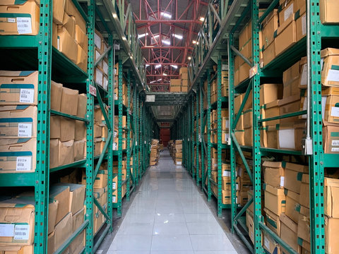 Document storage box Bulk paper box Storage box on a green iron shelf, Cardboard boxes on the shelves in the warehouse