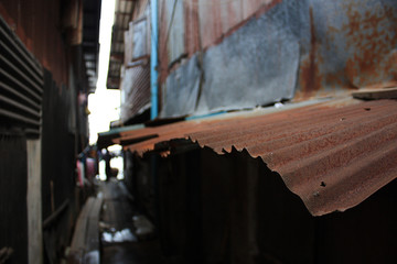 Closeup old zinc roof in alley. Thai house