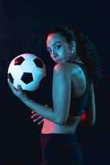 Front view sporty young girl with ball