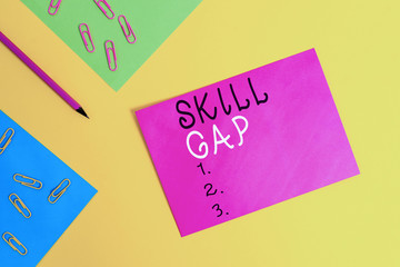 Word writing text Skill Gap. Business photo showcasing Refering to a demonstrating s is weakness or limitation of knowlege Blank paper sheets message pencil clips binders plain colored background