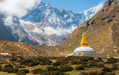 Buddhist stupa in Tibetan style with mountains view on the way to Everest Base Camp, Nepal.