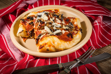 A piece of homemade pizza.