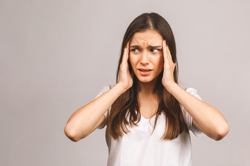 Fototapeta premium Young beautiful woman over isolated background suffering from headache desperate and stressed because pain and migraine. Hands on head.