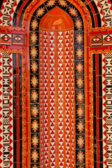 Red mosaic ornament decoration background, Eastern ethnic oriental texture. Muscat, Oman. Sultan...