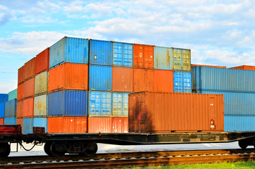 Fototapeta premium Cargo dock terminal with sea containers. logistic warehouse port of shipping container for the subsequent sorting, loading and sending them on freight railway cars or trucks to the client - Image