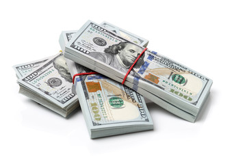 Many bundle of US 100 dollars bank notes isolated on white background 