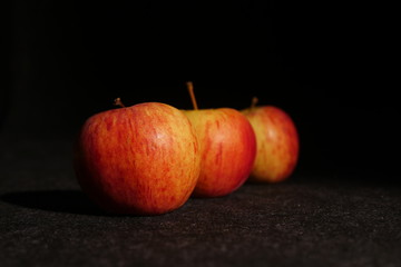 red apples on black background