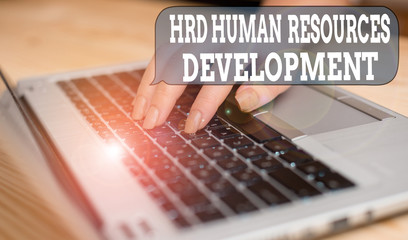 Writing note showing Hrd Huanalysis Resources Development. Business concept for helping employees develop demonstratingal skills woman with laptop smartphone and office supplies technology
