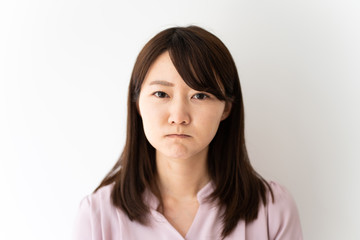 Fototapeta premium Angry business woman against white background