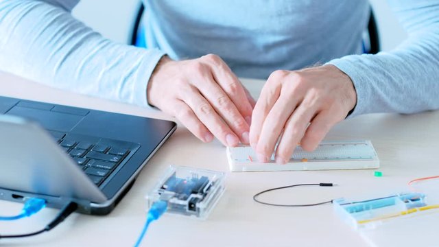 Electronics science. Home automation. IT engineer building project with microcontroller.