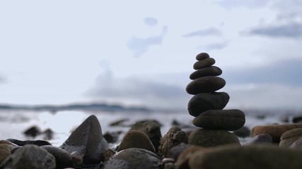 The stack of rock for healthy balance and aroma concept on the natural beach select focus shallow depth of field