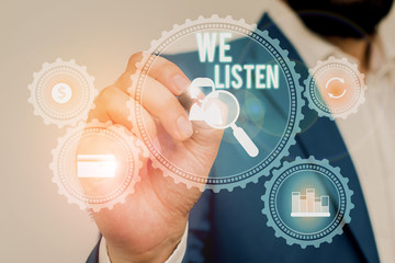 Text sign showing We Listen. Business photo showcasing Group of showing that is willing to hear...