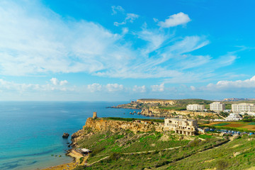 Gnejna bay and Golden Bay, the two most beautiful beaches in Malta in summer day with beautiful cloudy blue sky. Mgarr, Malta.