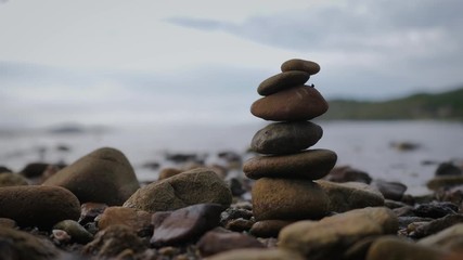 The stack of rock for healthy balance and aroma concept on the natural beach select focus shallow depth of field