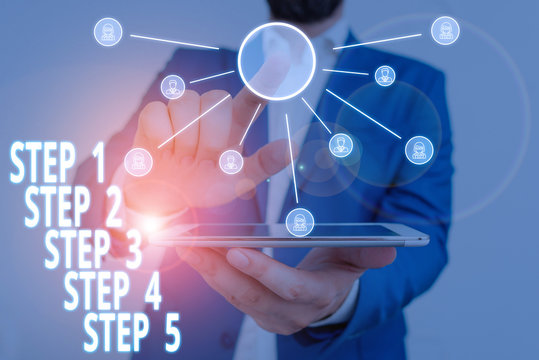 Word writing text Step 1, 2, 3, 4 and 5. Business photo showcasing Steps levels of a process work flow Male human wear formal work suit presenting presentation using smart device