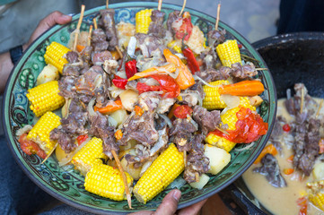 Dymlyama is an Uzbek national dish. Cooking dymlyama in a cauldron