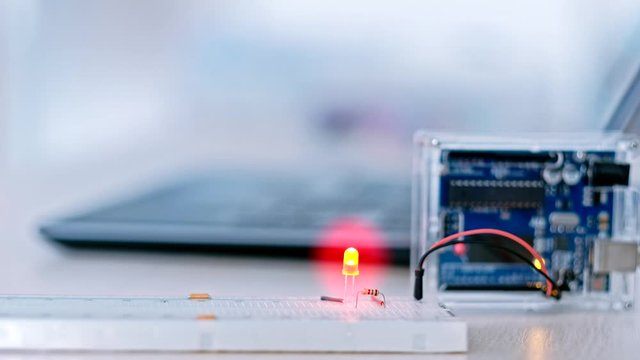 Robotics engineering. Home automation. Microcontroller digital signal. Led flash looped animation. Blur background.