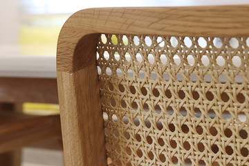 Closeup of wood chair with rattan, Beautiful  oak wood texture surface , rattan pattern. - obrazy, fototapety, plakaty