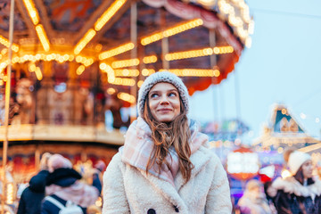 Girl walking on Christmas Market on Red Square in Moscow - obrazy, fototapety, plakaty