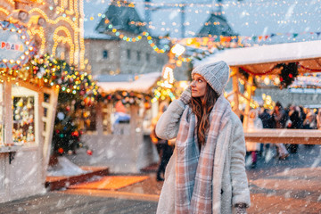 Girl walking on Christmas Market on Red Square in Moscow