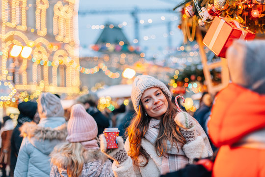Girl walking on Christmas Market on Red Square in Moscow