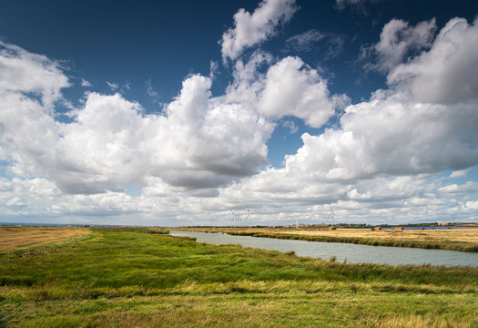 Capel Fleet and surrounding farmland, with New Rides Windfarm spoiling the view in the distance, Isle of Sheppy, Kent, England. 
