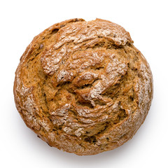 Round rustic whole wheat bread roll isolated on white. Top view.