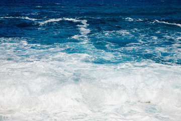 Natural background blue sea with waves, azure clear water beach