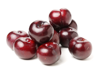 Plums on white background