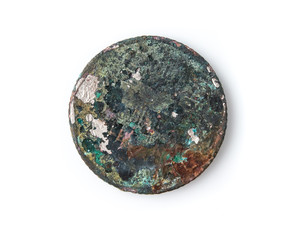 Old rusted coin,Oxidized old coin on white background.