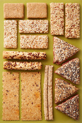 Assorted whole grain pastry snacks with seeds viewed from above. Flat lay. Top view. Chrono and vegetarian diet