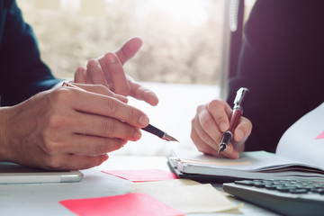 Business man supervising and secretary to execute business plan and consultant analyzing company...