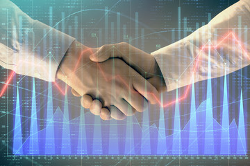 Multi exposure of forex graph on abstract background with two businessmen handshake. Concept of success on stock market
