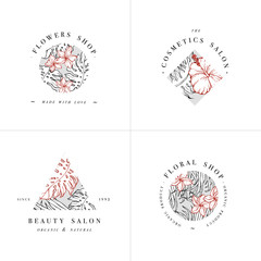 Simple logo collection. Engraved logotype set. Botanical beauty salon and organic cosmetic symbols with hibiscus and plumeria flowers. Tropical palm leaves. © oxygen_8