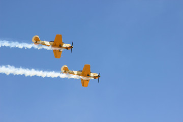 airplane with propeller flying in blue sky 