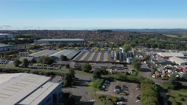 Drone aerial fly over industrial park warehouse distribution trucking facility