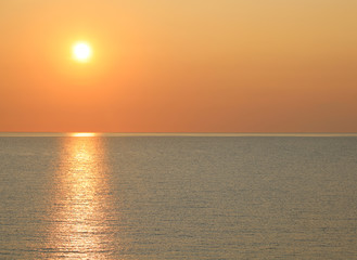 sun at sunset on the ocean