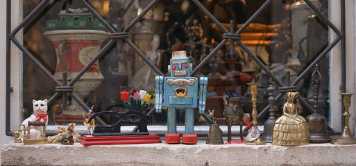 Vintage robot toy.  Vintage collectibles decorated on the windowsill with selective focus on the vintage robot toy.