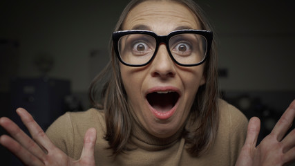 Shocked scared woman staring at camera