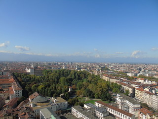 Obraz premium Turin, Italy - 10/02/2019: Travelling around North Italy. Beautiful caption of Turin wih sunny days and blue sky. Panoramic view to the city from Mole Antoneliana. Detailed photography of the old arch