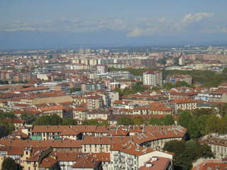 Fototapeta premium Turin, Italy - 10/02/2019: Travelling around North Italy. Beautiful caption of Turin wih sunny days and blue sky. Panoramic view to the city from Mole Antoneliana. Detailed photography of the old arch