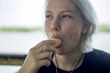 Girl funny eats ice cream in waffle horn