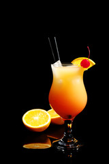 Just made appetizing cocktail Sex on the Beach, black background
