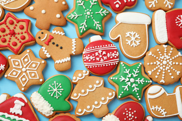 Flat lay composition with tasty homemade Christmas cookies on light blue background