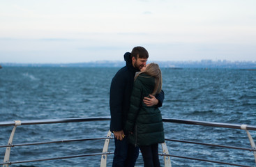 Fototapeta na wymiar winter love story. couple in the sea