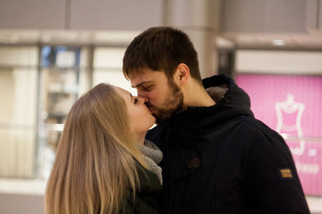 winter love story. couple in shopping center