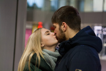 winter love story. couple in shopping center